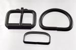 Two 1 1/2 inch black plated roller buckles, two <I>deluxe</i> belt keepers, and two D rings